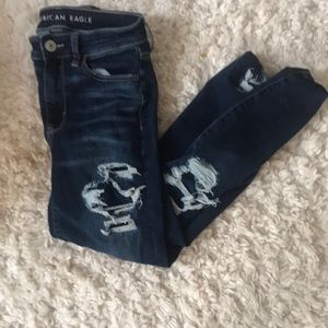 ripped dark blue jeans
